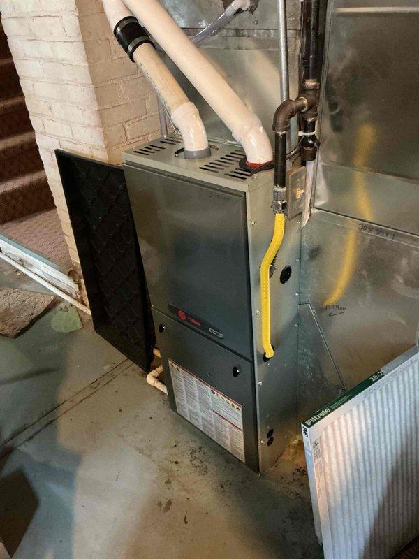 Completed annual cooling maintenance on Evcon HVAC system as part of Family Rewards membership. Replaced heavily soiled air filter, verified evaporator drain line was functioning properly, and inspected all electrical components at outdoor condenser unit. Capacitor tested weak during electrical diagnostics; provided estimate for replacement but homeowner declined repair due to age of equipment and preference to replace entire system in near future. Performed condenser coil cleaning and system startup, confirming 17-degree temperature split and proper operation. System currently operating within acceptable parameters despite weak capacitor reading.