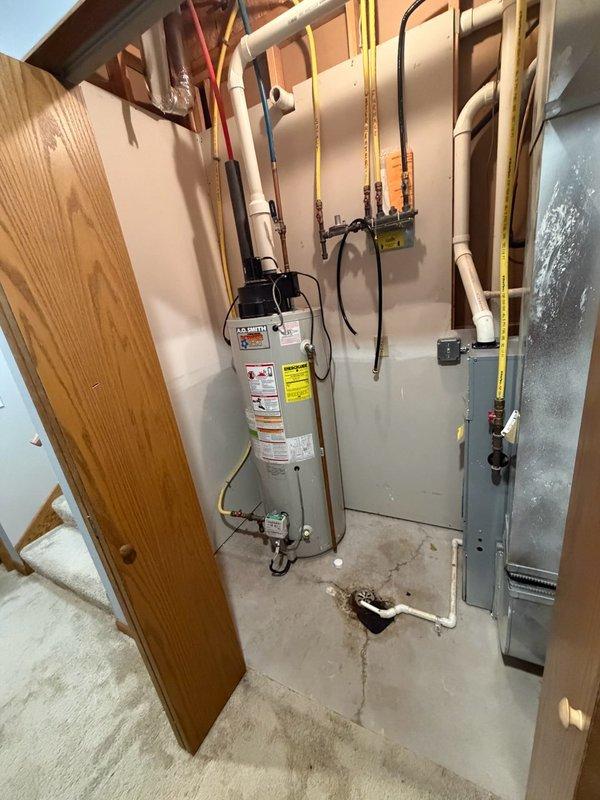 Responded to no hot water complaint and evaluated existing 50-gallon natural gas power vent water heater that had reached 21 years of service life. Unit exhibited intermittent failure to ignite; homeowner had previously cleaned burners which provided temporary resolution for approximately one week before complete ignition failure occurred. Upon inspection, determined water heater had reached end of useful service life and was no longer reliably operational. Documented existing installation including power vent configuration, gas line connections, and plumbing layout. Provided estimate for replacement with new 50-gallon natural gas power vent water heater and discussed alternative tankless water heater options with homeowner for consideration.