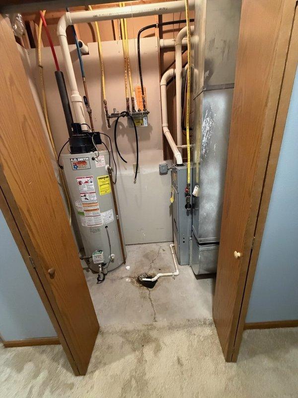 Responded to no hot water complaint and evaluated existing 50-gallon natural gas power vent water heater that had reached 21 years of service life. Unit exhibited intermittent failure to ignite; homeowner had previously cleaned burners which provided temporary resolution for approximately one week before complete ignition failure occurred. Upon inspection, determined water heater had reached end of useful service life and was no longer reliably operational. Documented existing installation including power vent configuration, gas line connections, and plumbing layout. Provided estimate for replacement with new 50-gallon natural gas power vent water heater and discussed alternative tankless water heater options with homeowner for consideration.