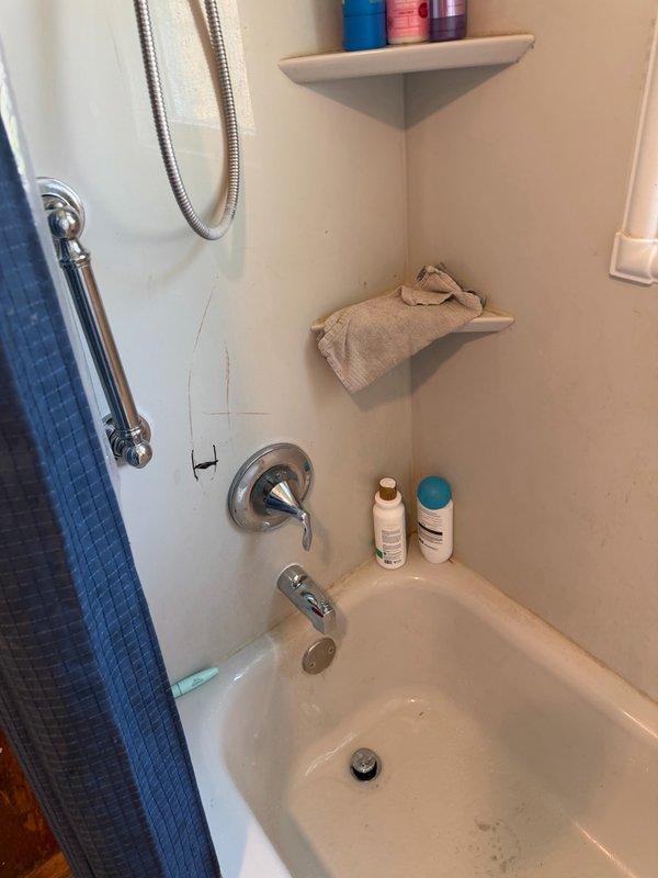 Responded to warranty callback for loose toilet bolts from previous installation. Tightened toilet mounting bolts to secure fixture properly to floor flange. Reattached loose toilet seat by clipping seat hardware back into mounting brackets. Removed old tub spout and installed new chrome tub spout, ensuring proper seal and secure connection to shower valve. Tested all repairs for stability and proper function. Documented completed work with photos.