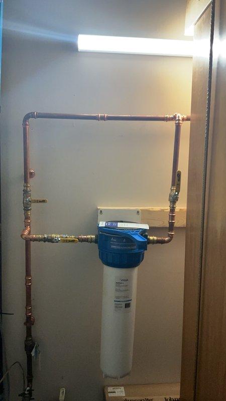 Completed follow-up phone call regarding no cold water issue at kitchen sink following whole-house water filtration system installation. Confirmed that shut-off valve had not been reopened after service completion. Customer was instructed to turn valve back on, which resolved the issue immediately.