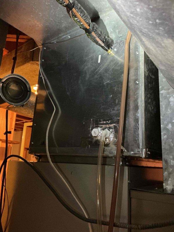 Performed routine AC maintenance tune-up on residential HVAC system, inspecting evaporator drain operation, air filter condition, and all electrical components. During indoor unit inspection, discovered blower motor capacitor testing out of specification and replaced component to restore proper system operation. Outdoor unit inspection confirmed clean condenser coils and all electrical connections in good condition, with system achieving proper 20-degree temperature split upon startup and operational testing.