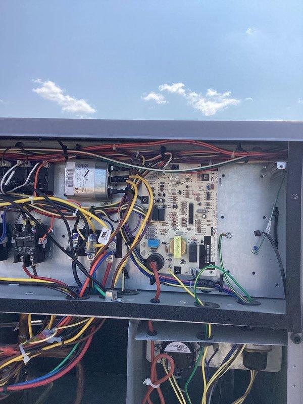 Performed annual cooling maintenance on commercial rooftop unit including comprehensive inspection of blower assembly, contactors, capacitors, dual compressors, control boards, and condenser fans. Replaced four 18x24x2 air filters, cleaned evaporator coil and condensate drain, serviced economizer, and cleaned outdoor coils. Verified refrigerant charge, high voltage power supply, and cycled system through full operational sequence with all components functioning within normal parameters.