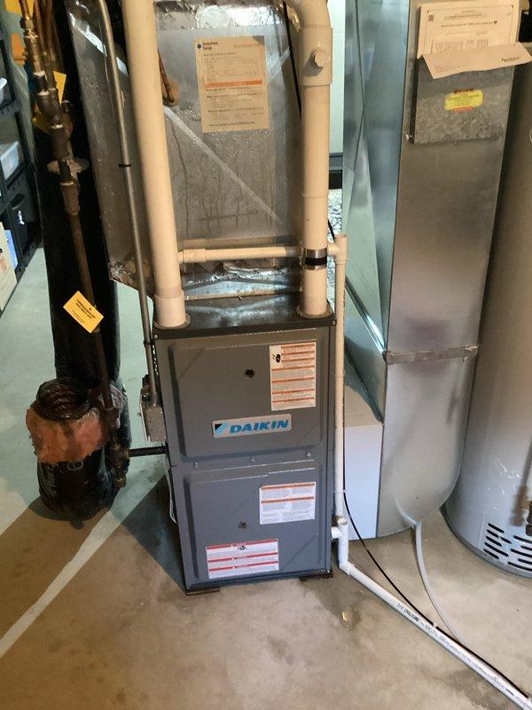 # HVAC Service Report - No Cooling Issue

Responded to no cooling complaint on 10-year-old residential HVAC system. Upon arrival, confirmed unit was not maintaining temperature below 76°F. Observed excessive condensation forming on exterior of equipment and identified frozen evaporator coil.

Performed system diagnostics and discovered critically low refrigerant charge. Cross-referenced service history which indicated low refrigerant readings documented during previous visit, confirming ongoing leak in system. Visual inspection revealed significant corrosion and rust deterioration on copper refrigerant lines, particularly at connection points and exposed sections. Corroded piping showed evidence of prolonged moisture exposure and age-related degradation.

Given the combination of recurring refrigerant loss, advanced corrosion on refrigerant lines, age of equipment, and previous repair attempts, determined system had reached end of serviceable life. Discussed repair versus replacement o