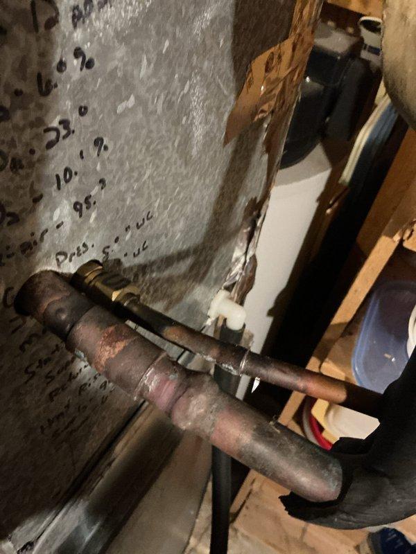 Responded to no cooling complaint on 7-year-old residential air conditioning system. Upon diagnostic evaluation, discovered refrigerant line set had been punctured by a nail during recent flooring installation. System assessment revealed dual capacitor testing significantly below manufacturer specifications. Replaced failed dual capacitor to restore proper compressor and condenser fan motor operation. Used refrigerant manifold gauges to verify system pressures and diagnose refrigerant leak from damaged line set. Provided quote for line set repair, which requires customer approval before scheduling completion of refrigerant circuit restoration.