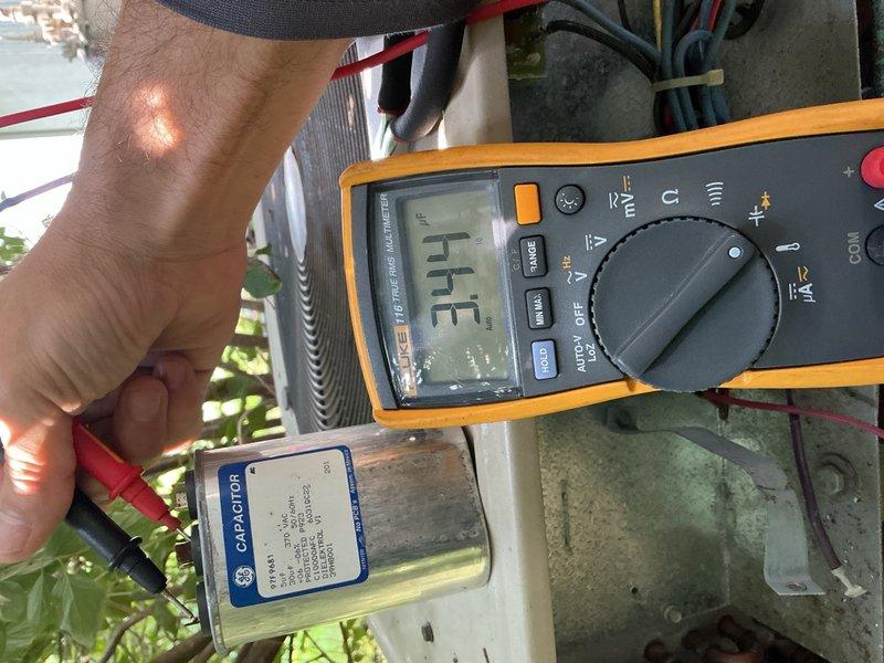 Completed complimentary maintenance inspection and tune-up on two Lennox AC systems from 1996, both utilizing R-22 refrigerant. Performed comprehensive system evaluation including capacitor testing, refrigerant level assessment, temperature differential measurements, and visual inspection of all major components.

Testing revealed both systems operating below optimal performance standards. First unit capacitor measured 26/3 MFD against rated 30/5 MFD specification; second unit capacitor measured 21/3 MFD against rated 25/5 MFD specification. Both systems showed low refrigerant charge levels. Temperature differential measurements recorded 12-13 degrees across both units, indicating inadequate cooling capacity below industry standard of 15-20 degrees.

Inspected and verified air filters, blower motors, and condensation drains on both systems—all components found in satisfactory condition. Examined outdoor units including condenser coils and electrical wiring; no deficiencies noted in the