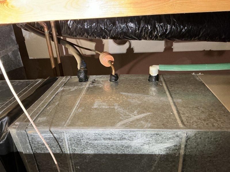 Completed complimentary maintenance inspection and tune-up on two Lennox AC systems from 1996, both utilizing R-22 refrigerant. Performed comprehensive system evaluation including capacitor testing, refrigerant level assessment, temperature differential measurements, and visual inspection of all major components.

Testing revealed both systems operating below optimal performance standards. First unit capacitor measured 26/3 MFD against rated 30/5 MFD specification; second unit capacitor measured 21/3 MFD against rated 25/5 MFD specification. Both systems showed low refrigerant charge levels. Temperature differential measurements recorded 12-13 degrees across both units, indicating inadequate cooling capacity below industry standard of 15-20 degrees.

Inspected and verified air filters, blower motors, and condensation drains on both systems—all components found in satisfactory condition. Examined outdoor units including condenser coils and electrical wiring; no deficiencies noted in the