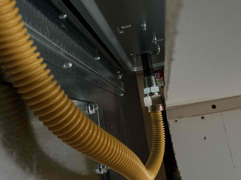 Completed propane gas line hookup to new stove installation. Disconnected existing gas connection, installed new gas line to stove, and performed comprehensive leak testing on all fittings and connections to verify system integrity. All connections tested with no leaks detected, ensuring safe operation of appliance.