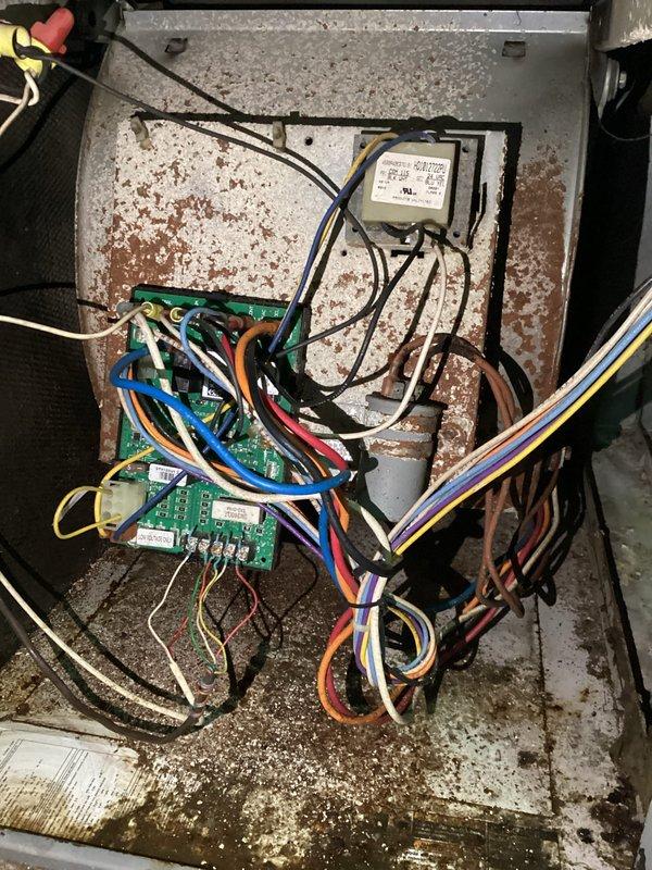 Responded to no cooling complaint on aging air conditioning system. Upon arrival, discovered control board heavily corroded and water-damaged, preventing voltage from reaching blower motor. Control board was completely non-functional due to moisture intrusion. Replaced defective control board and initiated assessment to identify water source causing the damage. System restored to operational status with new board installed. Recommended further investigation of moisture intrusion point to prevent future component failure.