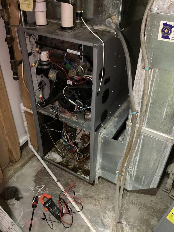 Responded to no cooling complaint on aging air conditioning system. Upon arrival, discovered control board heavily corroded and water-damaged, preventing voltage from reaching blower motor. Control board was completely non-functional due to moisture intrusion. Replaced defective control board and initiated assessment to identify water source causing the damage. System restored to operational status with new board installed. Recommended further investigation of moisture intrusion point to prevent future component failure.