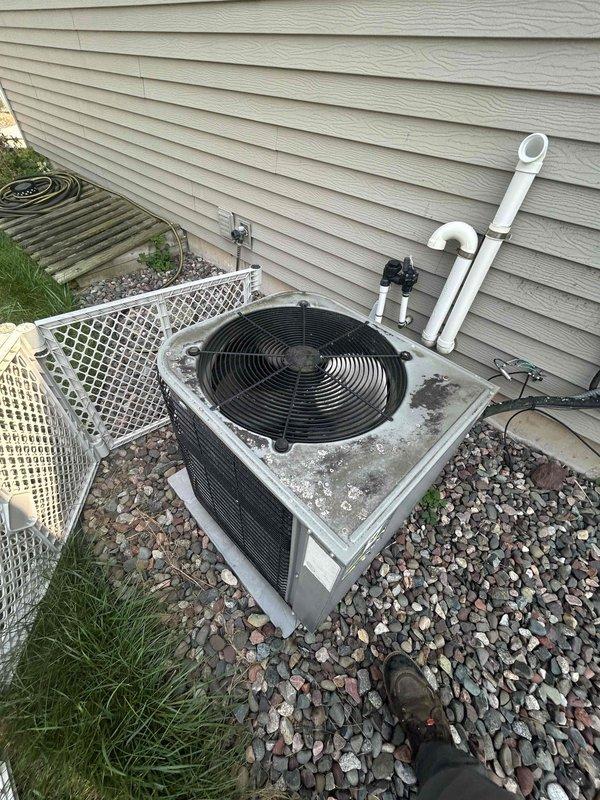 Completed comprehensive tune-up and preventative maintenance on 33-year-old residential air conditioning system. Performed full system inspection of outdoor condensing unit, verified operational performance of all components, cleaned condenser coil and fan assembly, checked refrigerant levels and electrical connections, and documented equipment condition with photos. Unit operational and ready for cooling season.
