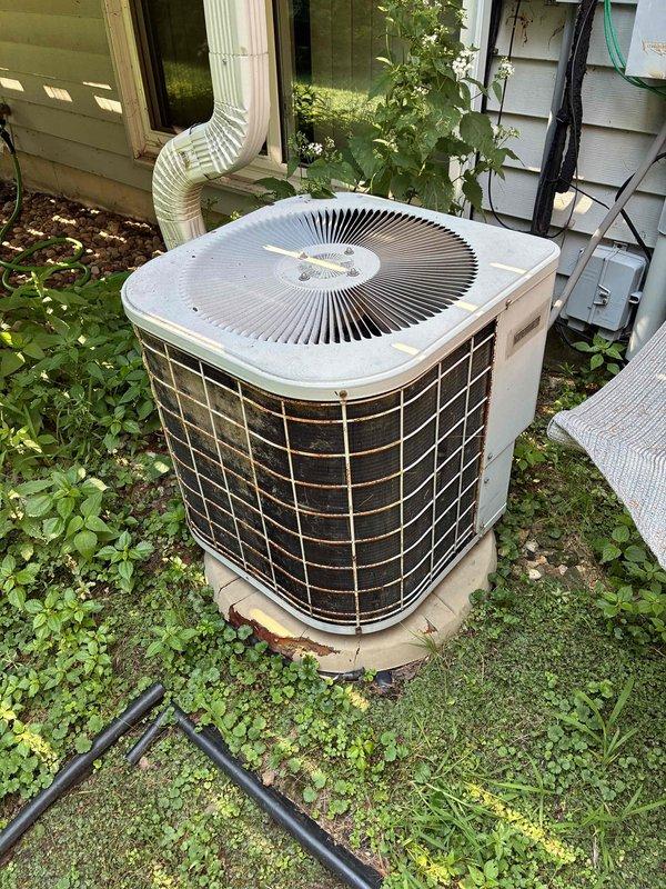 Responded to no cooling complaint on residential split system. Upon arrival, found outdoor condensing unit and indoor air handler operational but system failing to cool adequately. Performed diagnostic evaluation and measured refrigerant pressures, confirming low refrigerant charge on R-22 system. Verified adequate airflow through system by inspecting air filter and evaporator coil for cleanliness and blockages. Confirmed evaporator coil showed no signs of freezing or icing. Determined unit was manufactured in 1990, making it over 30 years old and operating with obsolete R-22 refrigerant. Due to age of equipment, obsolete refrigerant type, and potential for additional system failures, recommended system replacement rather than refrigerant recharge. Coordinated follow-up consultation to discuss replacement options and equipment upgrade.