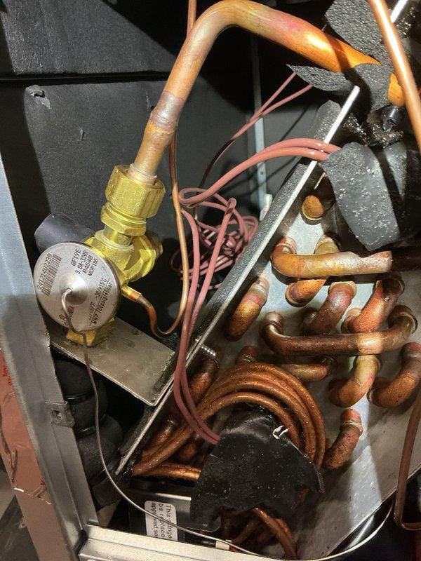 Responded to callback on recently installed Lennox AC system with compressor not operating and inadequate airflow. Upon arrival, confirmed condenser fan running but compressor failing to engage, with thermostat indicating cooling mode. Connected gauges and recorded initial pressures: low side 95 PSI with 29°F VSAT and -1.7°F subcooling, high side 260 PSI with 86°F LSAT. Adjusted blower speed to high setting and added 2 pounds of refrigerant to address system charge. Post-adjustment readings showed high side fluctuating between 260-350 PSI with 25°F subcooling and 110°F LSAT, low side at 96 PSI with 0.3°F superheat and 34°F VSAT. Compressor continued short-cycling every 3 minutes despite adjustments, indicating possible equipment defect or installation issue requiring advanced diagnostics. Explained situation and recommended rescheduling with senior technician for further troubleshooting and resolution. Documented unit condition and internal components with photos for follow-up service.