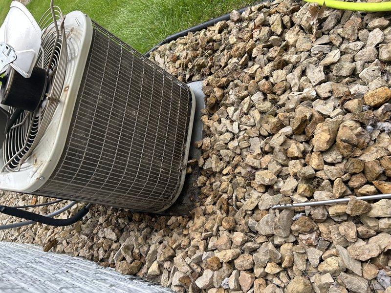 Completed comprehensive air conditioning tuneup and preventive maintenance on residential dual-zone system. Performed operational testing of both heating and cooling modes. Replaced air filter and verified proper operation of zone dampers throughout system. Conducted thorough inspection of blower compartment, checking motor, bearings, and electrical connections. Serviced outdoor condensing unit by cleaning condenser coils to remove accumulated debris and ensure optimal heat transfer efficiency. Measured and recorded refrigerant pressures and temperatures on both high and low sides of system, confirming proper charge levels and system performance within manufacturer specifications. All components tested and found operating correctly with no deficiencies noted.