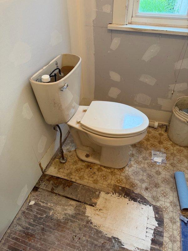 Completed water line repair in basement using copper piping with two brass fittings to address partial line failure up to 1" diameter. Capped obsolete water supply lines serving former kitchen sink and tub/shower locations to eliminate potential leak points. Reset half bath toilet with rubber spacers to compensate for uneven flooring conditions, ensuring proper seal and stability. All plumbing connections tested and verified leak-free upon completion.