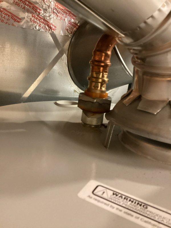 Completed biannual plumbing inspection with focus on water heater and overall system assessment. Inspected under-sink plumbing assembly, noting P-trap configuration with chrome-plated pipes showing age-appropriate wear and minor corrosion at connection points. Observed copper oxidation and verdigris formation at joints, typical of older installations but not requiring immediate intervention. Verified drain assembly and flexible supply lines remain functional. 

Coordinated HVAC system inspection during same visit, examining copper refrigerant line connections and service valves. All components operating within normal parameters with no new issues identified. Annual inspection confirmed system integrity maintained through proper homeowner care.