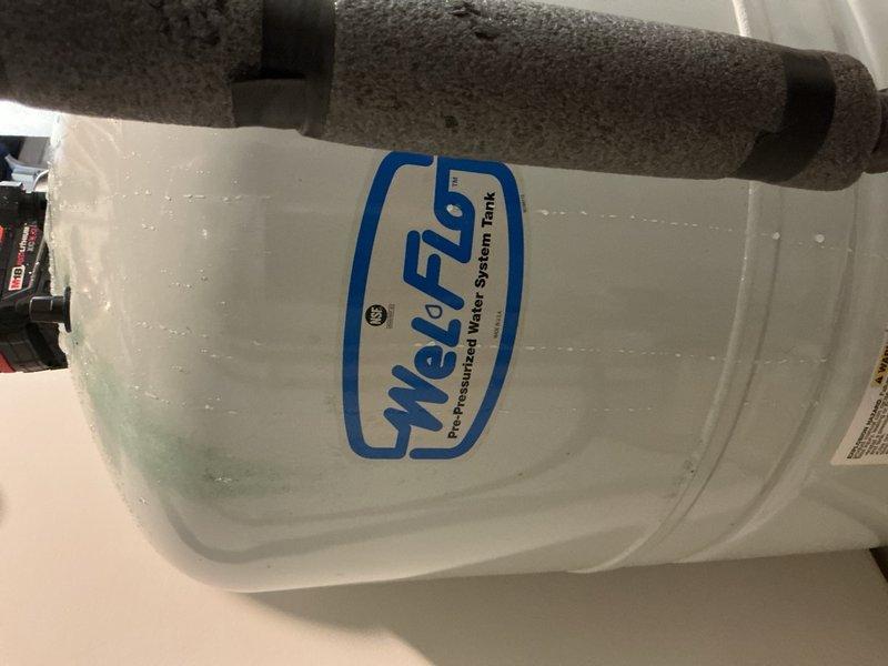 Responded to callback for water softener experiencing intermittent leaking one to two times per month since recent installation. Upon inspection, identified source of leak as failed discharge adapter with visible split causing water to saturate carpeted floor beneath unit. Removed damaged discharge adapter and installed new replacement component. Verified all connections secure and tested system operation to confirm leak resolved. No further issues detected at time of completion.