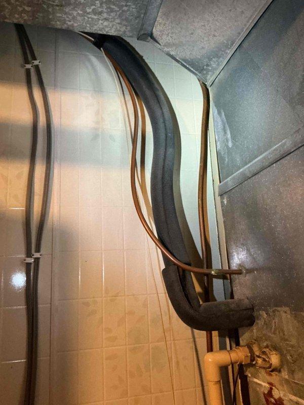 Responded to no cooling call on aging HVAC system with known refrigerant leak that was recently recharged by another contractor. Performed system evaluation and documented existing furnace and air conditioning equipment with detailed photographs of mechanical room installation, including ductwork, copper refrigerant lines, and current equipment configuration. Coordinated with service advisor to schedule replacement estimate consultation, as customer expressed strong interest in complete system replacement rather than continued repairs to aging equipment.