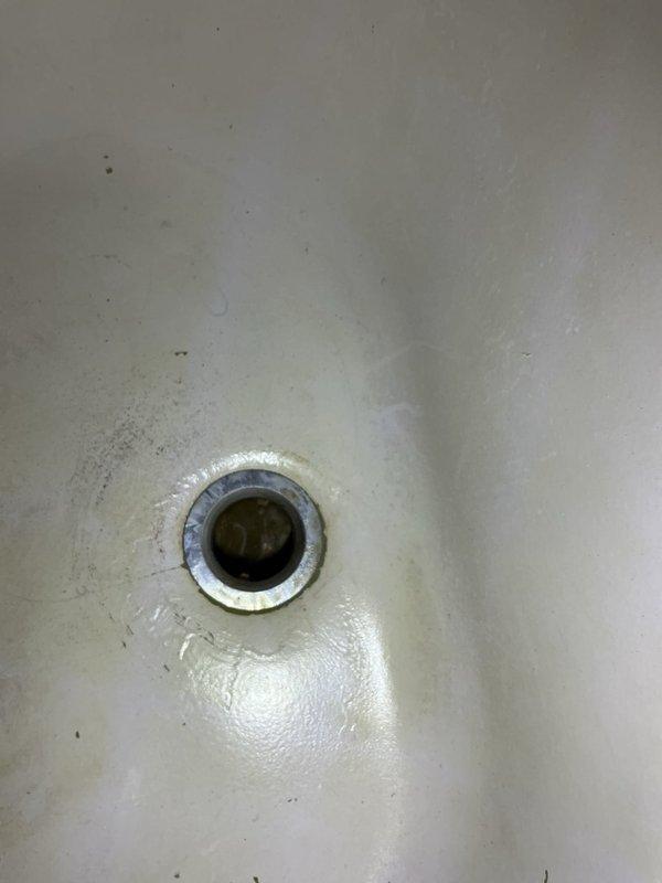 Responded to a water leak originating from an upstairs shower trap that was dripping into the downstairs bathroom. Upon inspection, identified a faulty tub waste and overflow assembly as the source of the leak. Presented repair options to the customer and proceeded with the replacement of the complete tub waste and overflow system. Successfully installed new chrome-plated waste and overflow assembly, ensuring proper sealing and drainage function. Tested the installation for leaks and verified the repair eliminated water intrusion to the lower level.
