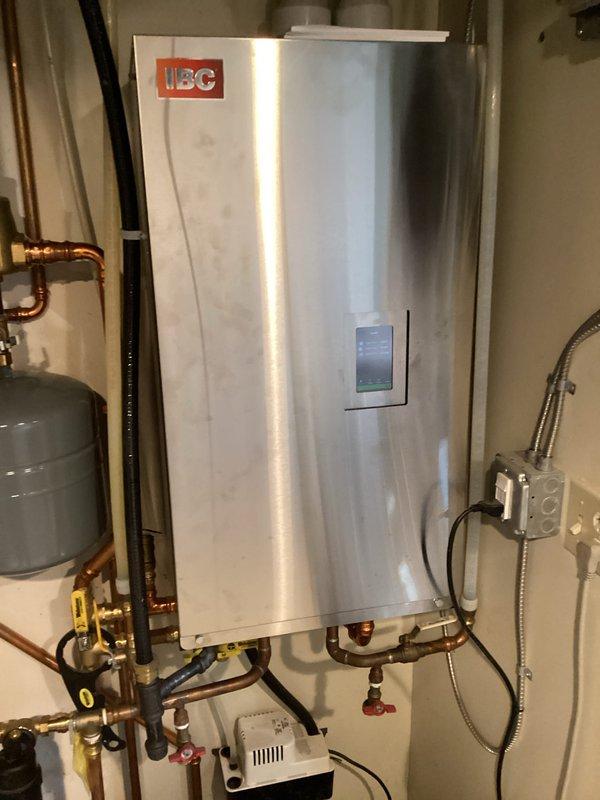 Responded to callback for backflow preventer failure that caused significant water damage to laundry room floor. Upon inspection, discovered relief discharge valve improperly positioned over doorway and autofill device installed incorrectly with discharge not meeting code requirements. Removed failed components and installed new autofill device with proper discharge piping routed to code-compliant safe disposal location, eliminating potential water damage hazards.