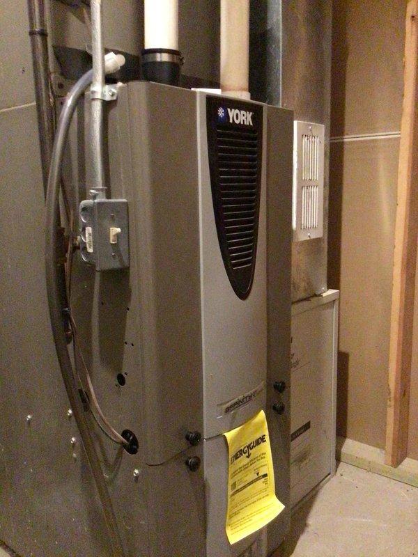 Completed routine AC tune-up maintenance on York HVAC system with air handler located in basement and outdoor condensing unit. Performed comprehensive system inspection, washed and tested outdoor unit, verified all electrical components within manufacturer specifications, and confirmed proper system operation. Customer had recently replaced air filter prior to service visit.