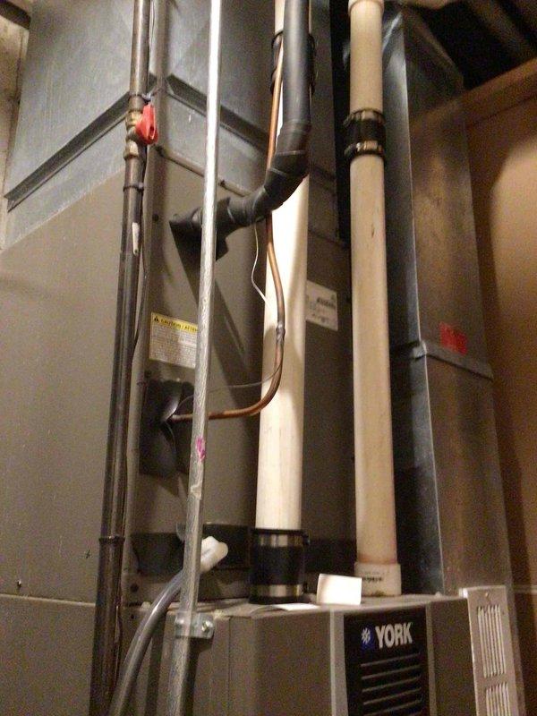 Completed routine AC tune-up maintenance on York HVAC system with air handler located in basement and outdoor condensing unit. Performed comprehensive system inspection, washed and tested outdoor unit, verified all electrical components within manufacturer specifications, and confirmed proper system operation. Customer had recently replaced air filter prior to service visit.