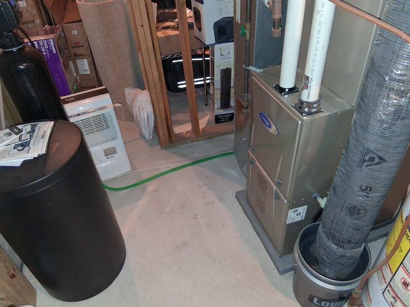 Responded to no cooling complaint on Carrier system. Diagnosed ECM blower motor failure after observing humming noise from furnace with no air movement, while outdoor unit operated normally when thermostat wires were jumped. Replaced defective ECM blower motor and restored system to normal operation. Discussed system replacement options due to unit age and provided information for future equipment upgrade consideration.