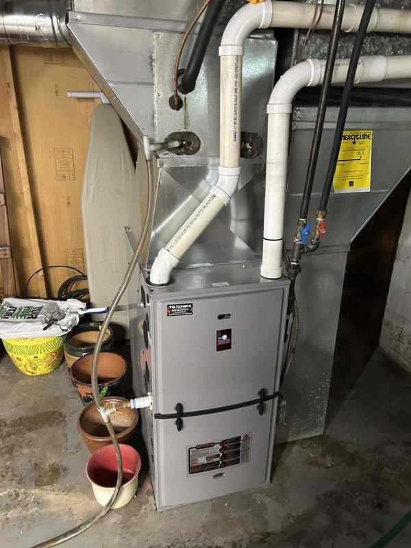 Completed annual cooling maintenance on 24-year-old Amana HVAC system as part of Family Rewards agreement. Performed comprehensive AC tune-up including inspection of evaporator coil, which showed dust and debris accumulation on fins with visible oxidation on refrigerant lines consistent with system age. Verified refrigerant line connections, checked condensate drainage system, and inspected furnace cabinet and associated PVC venting. All components functioning within normal parameters with no current issues identified by customer or during inspection.