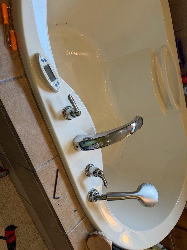 Completed inspection of malfunctioning Roman tub faucet diverter that had been sticking and required manual force to operate. Diverter mechanism failed and would no longer lift to activate the handheld sprayer function. After attempting repair, determined complete replacement of trim kit and valve body is required, necessitating access through basement ceiling below the fixture.