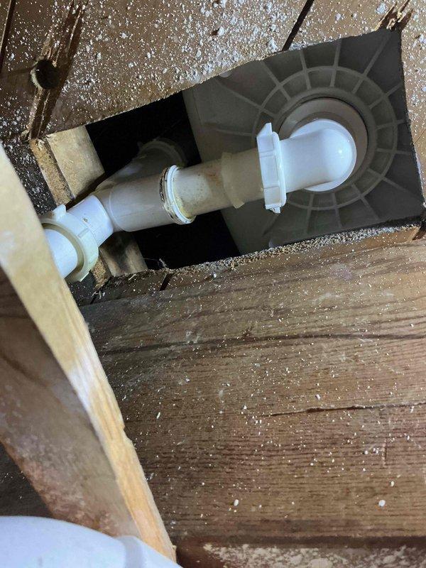 Responded to a shower drain leak originating from the tub waste overflow assembly. Upon inspection, identified the leak at the strainer arm slip nut caused by an improperly installed gasket that had been positioned backwards. Disassembled the complete tub waste and overflow system, replaced all worn gaskets with new components, and reassembled the drain assembly to manufacturer specifications, eliminating the leak.