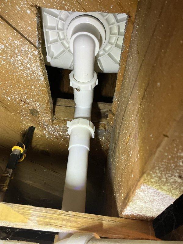 Responded to a shower drain leak originating from the tub waste overflow assembly. Upon inspection, identified the leak at the strainer arm slip nut caused by an improperly installed gasket that had been positioned backwards. Disassembled the complete tub waste and overflow system, replaced all worn gaskets with new components, and reassembled the drain assembly to manufacturer specifications, eliminating the leak.