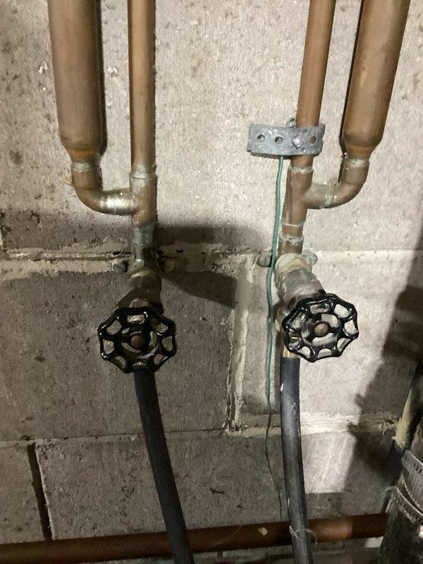 Responded to laundry room plumbing issue where hot and cold water supply valves serving the washing machine were frozen in the open position and actively leaking. Upon inspection, determined that the existing gate valves were seized and could not be repaired. Replaced both laundry supply valves with new shut-off valves featuring black wheel handles, ensuring proper water flow control and eliminating the leak. Tested both hot and cold water lines for proper operation and verified no additional leaks were present at connections.