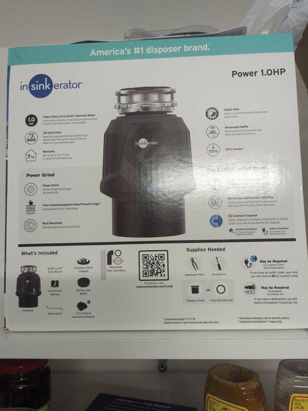Completed installation of customer-supplied InSinkErator Power 1.0HP garbage disposal unit with 3D Grind Plus technology. Connected disposal to existing drain system using white PVC P-trap assembly and verified proper alignment with dual sink configuration. All connections tested and confirmed operational with no leaks detected.