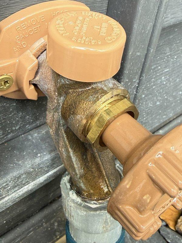 Responded to callback for leaking outdoor hose bib that was recently replaced. Upon inspection, identified failed vacuum breaker on the new Woodford spigot as the source of the leak at the top cap portion. Removed defective vacuum breaker and installed new Woodford vacuum breaker assembly, resolving the leak issue.