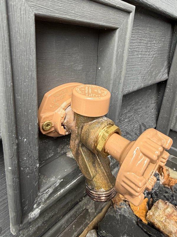 Responded to callback for leaking outdoor hose bib that was recently replaced. Upon inspection, identified failed vacuum breaker on the new Woodford spigot as the source of the leak at the top cap portion. Removed defective vacuum breaker and installed new Woodford vacuum breaker assembly, resolving the leak issue.