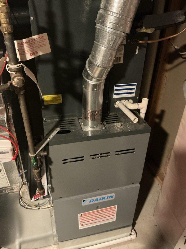 Responded to no-cool complaint on 11-year-old Daikin air conditioning system that experienced unusual noise during nighttime operation before shutting down, with outdoor fan continuing to run. Diagnostic testing confirmed dual component failure: capacitor and compressor both inoperative. Documented failed components with photographic evidence showing capacitor with multiple wire connections and accumulated debris within electrical compartment. Submitted parts order form for warranty compressor replacement pricing and estimate, provided estimate for complete system replacement scheduled for customer review.