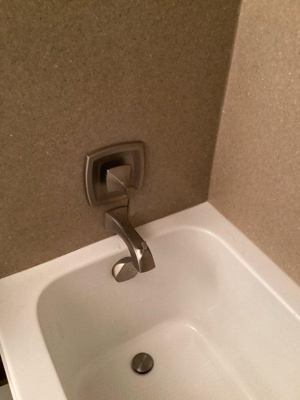 Responded to emergency call for bathtub faucet that would not shut off, requiring the main water supply to the residence to be turned off. Upon inspection, diagnosed a failed cartridge in the tub valve assembly causing continuous water flow. Removed the defective cartridge and installed a replacement cartridge, restoring proper operation to the bathtub faucet and allowing the main water supply to be turned back on.