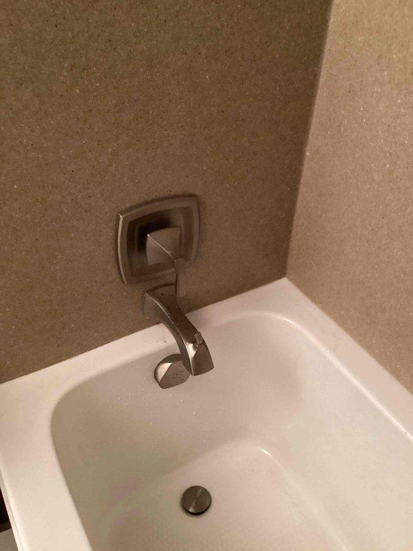 Responded to emergency call for bathtub faucet that would not shut off, requiring the main water supply to the residence to be turned off. Upon inspection, diagnosed a failed cartridge in the tub valve assembly causing continuous water flow. Removed the defective cartridge and installed a replacement cartridge, restoring proper operation to the bathtub faucet and allowing the main water supply to be turned back on.
