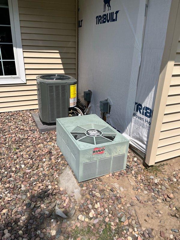 Responded to no cooling complaint on 25+ year old RUUD system. Upon arrival, found outdoor disconnect in unknown state due to ongoing siding replacement work in neighborhood. Discovered mouse nest in outdoor unit and chewed thermostat wires. Reset power at both exterior breaker and disconnect, system immediately functioned normally with proper cooling. Removed rodent nest debris, replaced damaged thermostat wiring, and cycled power multiple times to verify consistent operation. System operated without issues through all test cycles, achieving 17-degree temperature split across evaporator coil. Advised customer of unit's age and recommended obtaining replacement estimates given advanced age of equipment. Unit left in proper working condition.