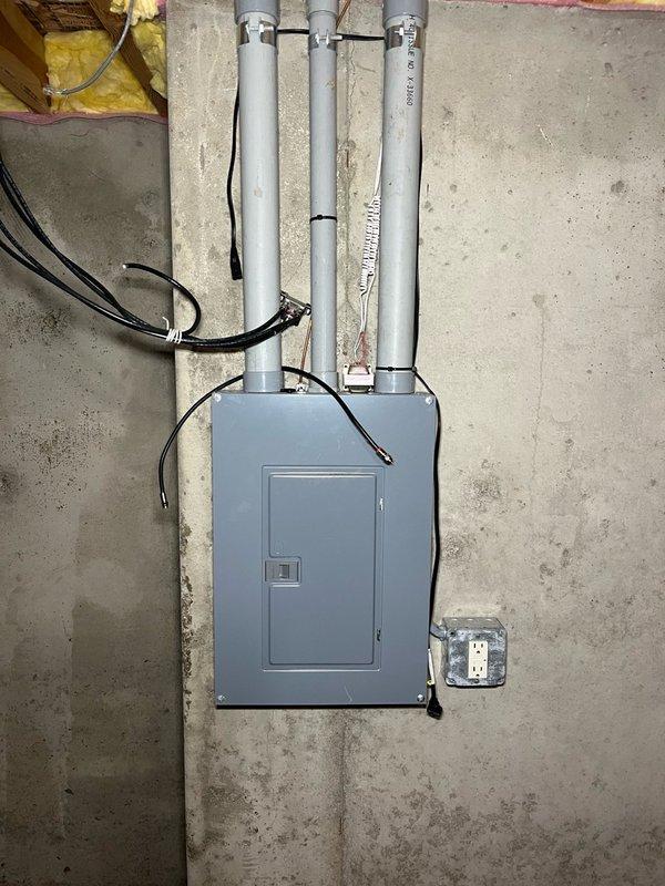 Responded to no cooling complaint on 25+ year old RUUD system. Upon arrival, found outdoor disconnect in unknown state due to ongoing siding replacement work in neighborhood. Discovered mouse nest in outdoor unit and chewed thermostat wires. Reset power at both exterior breaker and disconnect, system immediately functioned normally with proper cooling. Removed rodent nest debris, replaced damaged thermostat wiring, and cycled power multiple times to verify consistent operation. System operated without issues through all test cycles, achieving 17-degree temperature split across evaporator coil. Advised customer of unit's age and recommended obtaining replacement estimates given advanced age of equipment. Unit left in proper working condition.