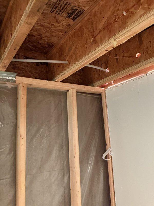 Responded to emergency call for burst PEX ice maker line that caused water damage to basement ceiling. Removed damaged ceiling materials to access failed line, then replaced entire ice maker supply line with new copper piping for improved durability and longevity. Additionally, installed new toilet fixture and replaced faulty trap on basement lavatory sink to resolve drainage issues.
