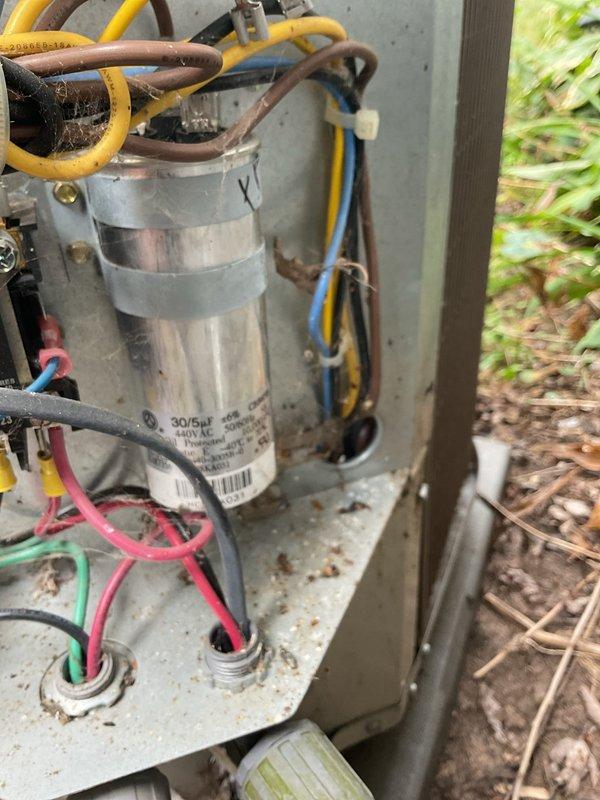 Responded to no cooling complaint on 2015 system where outdoor unit failed to engage overnight. Upon arrival, system was operational but performance testing revealed failed dual run capacitor reading 23 µF on compressor side (spec: 30 µF) and 3.5 µF on fan side (spec: 5 µF). Superheat measured 26°F indicating possible low refrigerant charge, with subcooling at 5°F confirming system was slightly undercharged. Replaced out-of-spec capacitor with proper 30/5 µF unit, restoring normal compressor and condenser fan operation. System tested and confirmed operational after capacitor replacement. Provided estimate for refrigerant charge adjustment to optimize system performance.