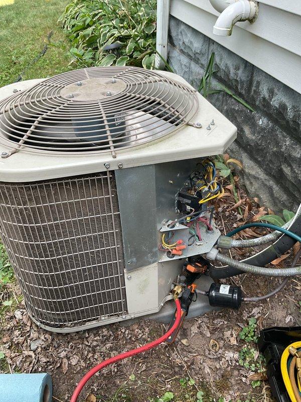 Responded to no cooling complaint on 2015 system where outdoor unit failed to engage overnight. Upon arrival, system was operational but performance testing revealed failed dual run capacitor reading 23 µF on compressor side (spec: 30 µF) and 3.5 µF on fan side (spec: 5 µF). Superheat measured 26°F indicating possible low refrigerant charge, with subcooling at 5°F confirming system was slightly undercharged. Replaced out-of-spec capacitor with proper 30/5 µF unit, restoring normal compressor and condenser fan operation. System tested and confirmed operational after capacitor replacement. Provided estimate for refrigerant charge adjustment to optimize system performance.