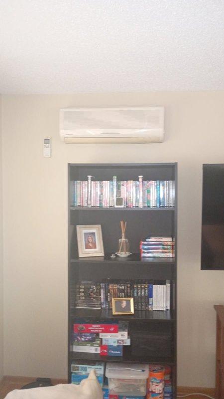 Responded to no cooling complaint on multi-zone mini split system. Upon arrival, verified upstairs indoor head unit fan operational but blowing warm air while main floor unit cooling properly. Inspected both indoor head units, confirmed filters and evaporator coils clean and unobstructed. Proceeded to outdoor condenser unit for diagnostic evaluation. Inspected condenser coil for blockage or debris, found satisfactory. Performed electrical testing on capacitors and identified failed 20 MFD capacitor reading below manufacturer specifications. Replaced defective capacitor with OEM equivalent part. Restored power and cycled system through complete operational test. Verified upstairs head unit now delivering proper cooling temperatures and airflow. Confirmed both zones operating within normal parameters before clearing service call.