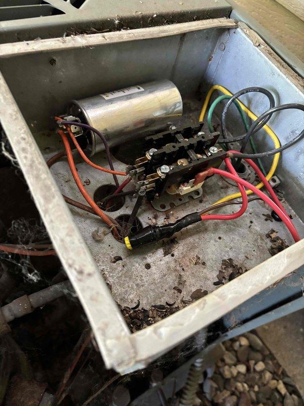 Responded to no cooling call on 10+ year old Ruud R-22 system. Verified thermostat operation normal. Inspected outdoor unit and found contactor failed - confirmed 240V and 24V power supply present but no 240V output to compressor circuit. Replaced defective contactor and restored system operation. Initial temperature split measured only 7 degrees across evaporator coil. Identified heavily soiled air filter restricting airflow and replaced with new filter. Found outdoor condenser coil significantly clogged with dirt and debris. Performed coil cleaning by rinsing down outdoor unit. Rechecked temperature split after cleaning, which improved to 15 degrees, confirming restored cooling efficiency. System now operating within normal parameters.