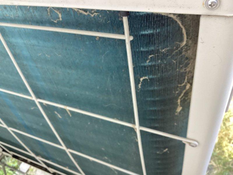 Performed follow-up maintenance inspection on mini-split system to verify and document previous service work completed by another contractor. Conducted comprehensive tune-up including visual inspection of outdoor condenser unit, which showed weathering and dirt accumulation on protective grille and housing consistent with extended outdoor exposure. System diagnosed with low refrigerant charge requiring attention; provided repair estimate for refrigerant recharge service to restore proper operating levels and system efficiency.