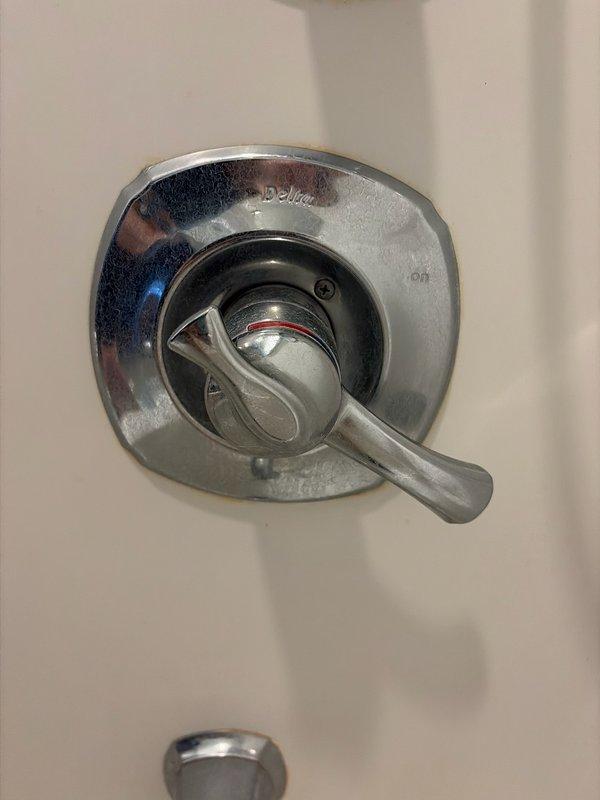 Responded to a shower handle malfunction where the lever was spinning freely without engaging the valve cartridge. Upon inspection, determined that the mounting screws had loosened, causing the handle to detach from the valve stem threads. Tightened all mounting hardware and secured the handle assembly to proper torque specifications, restoring full operational control of the shower valve. Demonstrated the repair procedure to the homeowner for future reference. Additionally provided an estimate for cartridge replacement as a preventive maintenance option, though the homeowner elected to proceed only with the handle adjustment at this time. Verified proper hot and cold water control function before completing the service call.