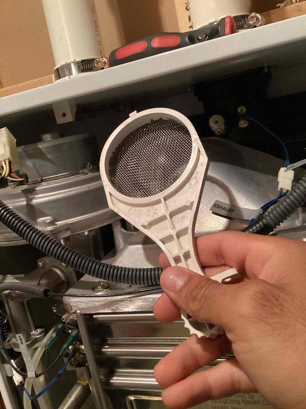 Responded to service call for 12-year-old Navien tankless water heater displaying multiple error codes requiring frequent resets. Upon inspection, diagnosed issue as clogged inlet filter causing pressure-related faults. Removed and thoroughly cleaned the filter assembly, restoring proper water flow and system operation. Unit tested successfully with no error codes present after filter maintenance was completed.