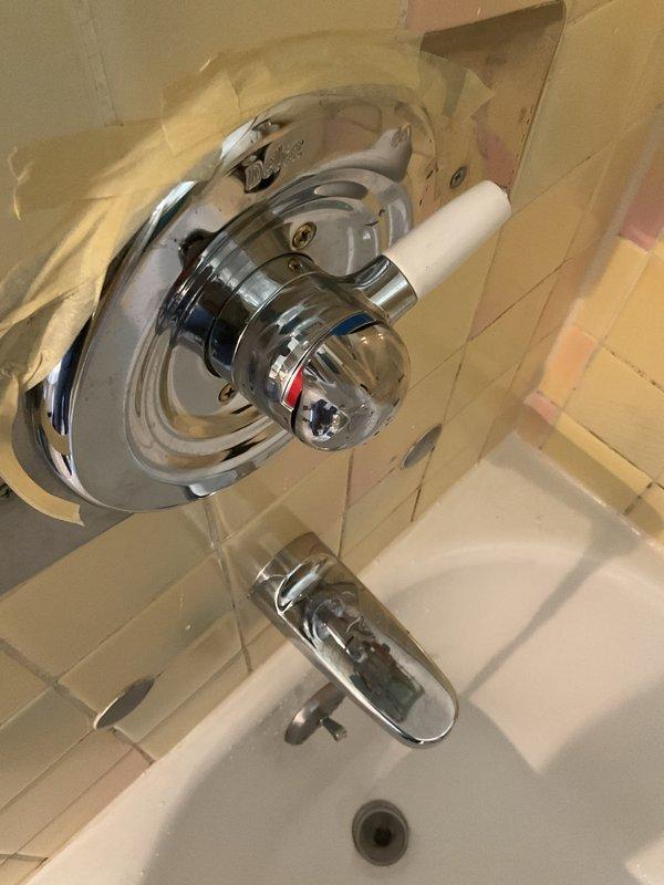 Completed no-charge callback to correct shower valve handle orientation. Handle was initially installed facing the shower wall, preventing visibility of hot/cold temperature indicators. Rotated valve handle 180 degrees so red and blue temperature markings now face outward for proper user visibility and operation. Verified proper function of single-handle shower control and confirmed customer satisfaction with corrected placement.