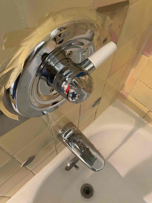 Completed no-charge callback to correct shower valve handle orientation. Handle was initially installed facing the shower wall, preventing visibility of hot/cold temperature indicators. Rotated valve handle 180 degrees so red and blue temperature markings now face outward for proper user visibility and operation. Verified proper function of single-handle shower control and confirmed customer satisfaction with corrected placement.